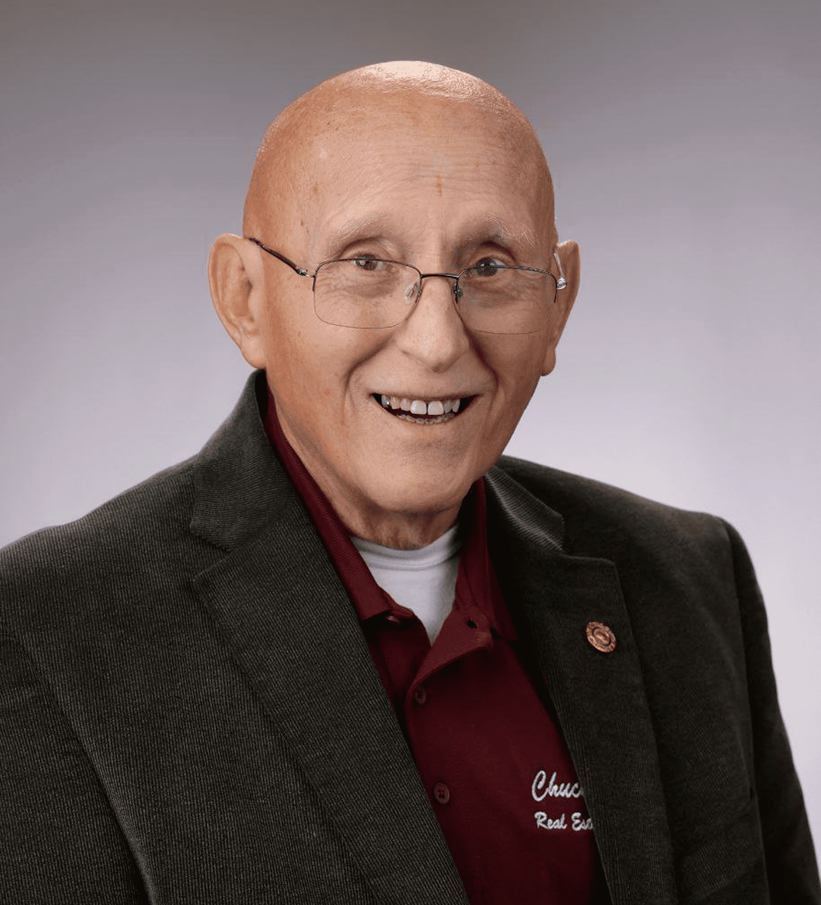 Portrait of cheerful elderly man wearing glasses